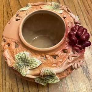 Vintage pottery piece with rich texture and applied grape leaf/grape design.